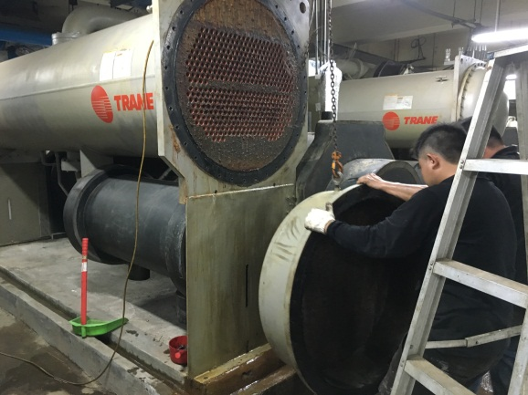 Cleaning the condenser within the water chiller in Siwei Administration Center.png
